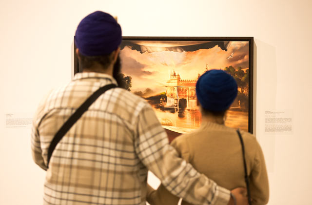 couple admiring art at Sikh Heritage Month celebrations