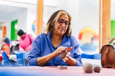 A woman modelling clay