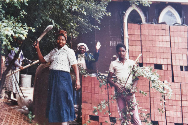 People standing near Church repairs