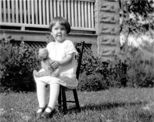 Peel-based photographer Betty Odlum (1924-2015) as a child around 1925, holding a teddy bear that is now in PAMA’s Museum collection.