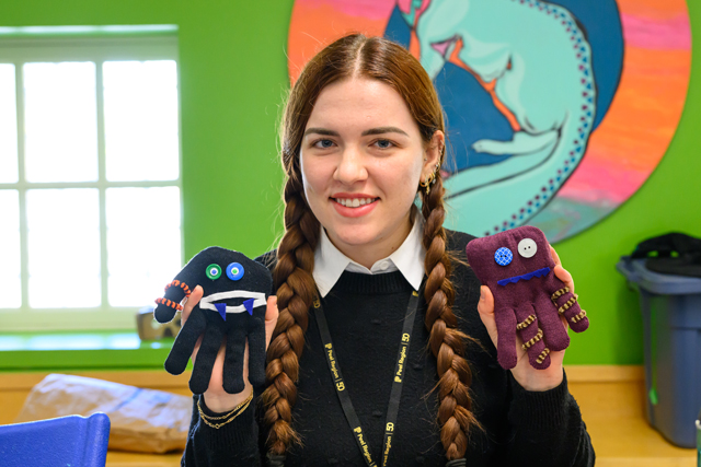 girl holding crafts in hands