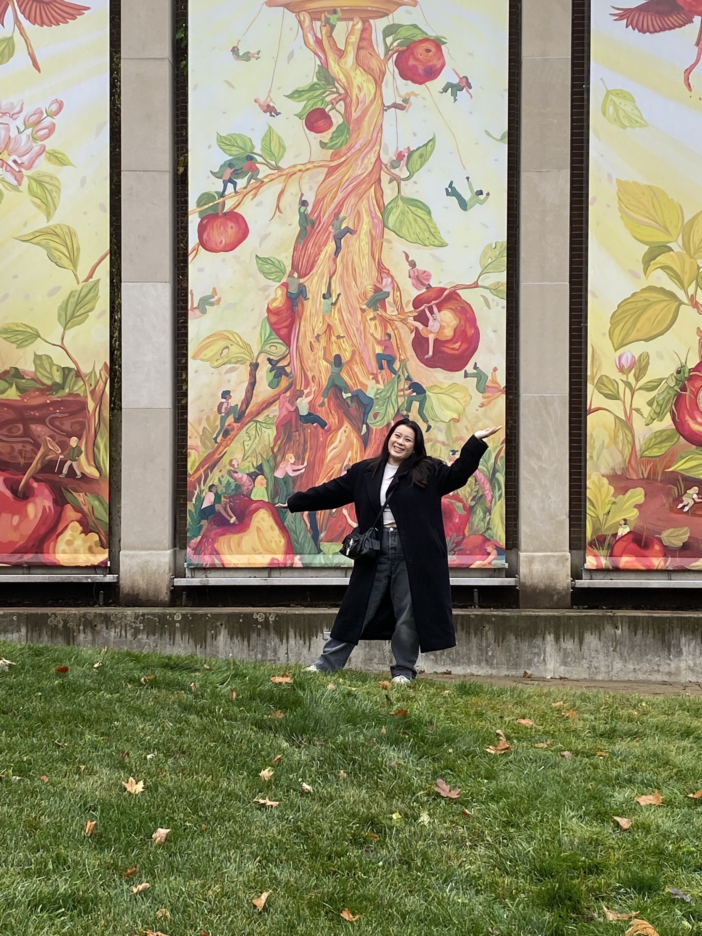 Meegan Lim w Apple a day banners